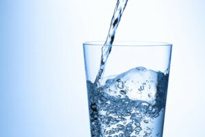 Pouring water into a glass