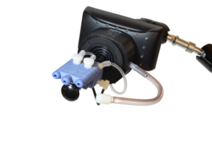 A plastic video game controller with clear tubes and puff and sip inputs