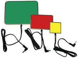Green, red, and yellow large buttons with cords attached